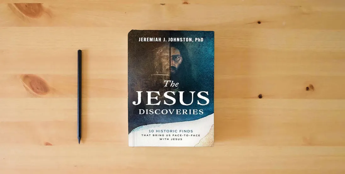 The book The Jesus Discoveries: 10 Historic Finds That Bring Us Face-to-Face with Jesus} is on the table