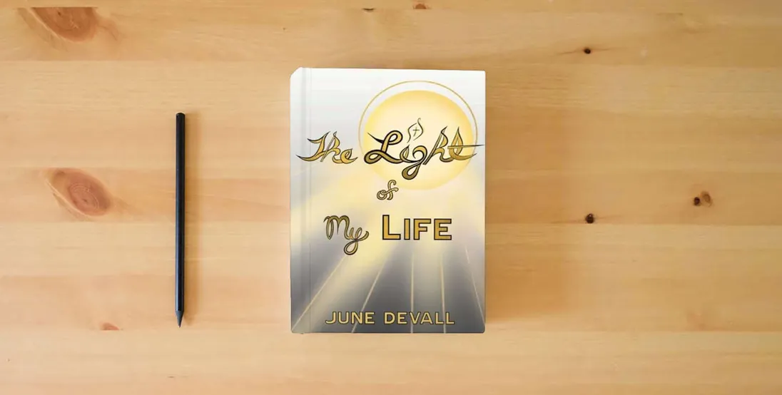 The book The Light of My Life} is on the table