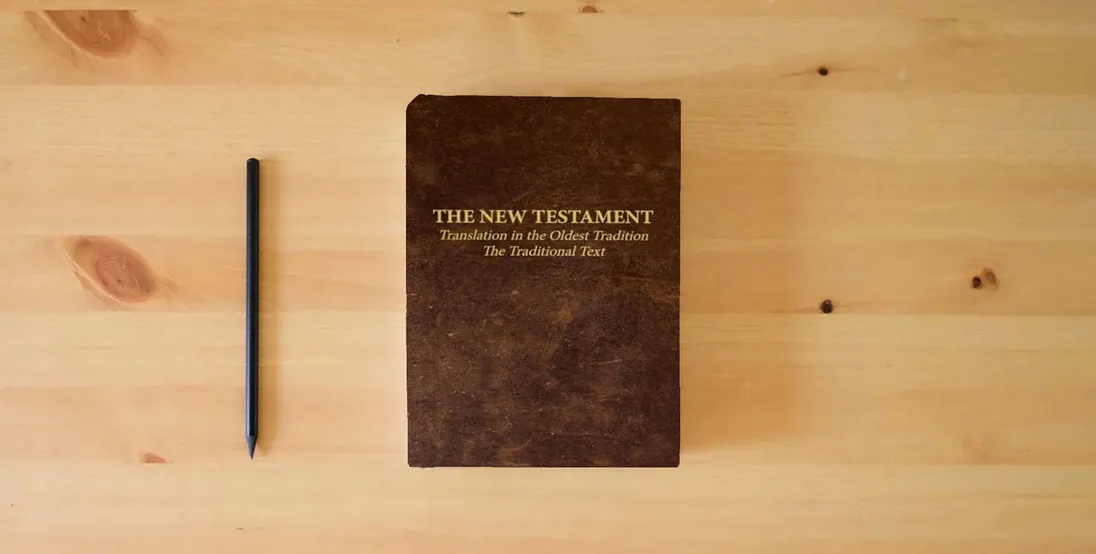 The book The New Testament - Translation in the Oldest Tradition: The Traditional Text} is on the table