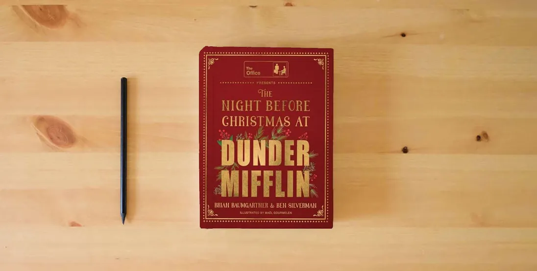 The book The Night Before Christmas at Dunder Mifflin: A hilarious and heartwarming retelling of a Christmas classic and perfect holiday gift for fans of The Office.} is on the table