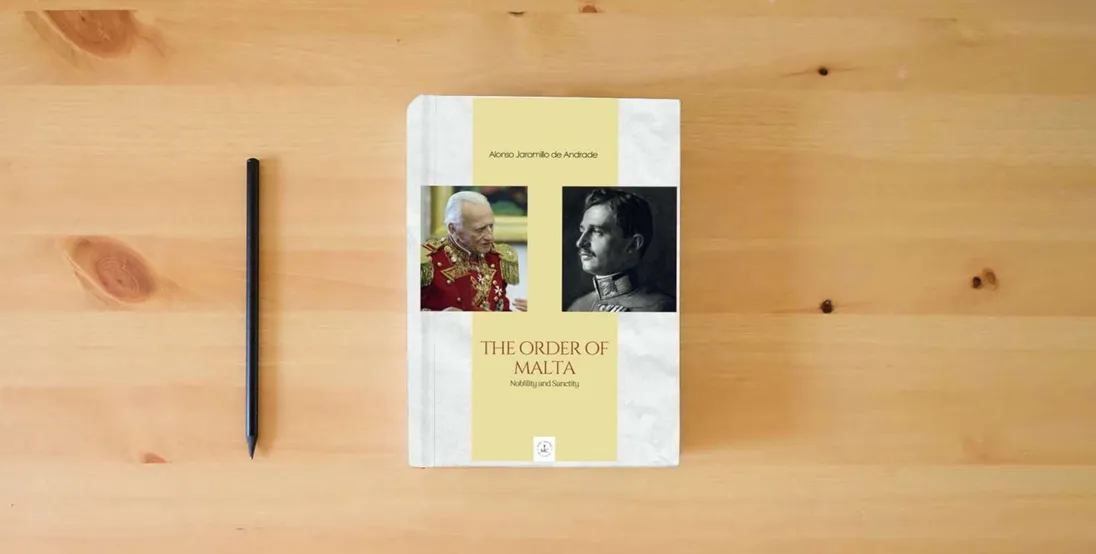 The book THE ORDER OF MALTA Nobility and Sanctity} is on the table