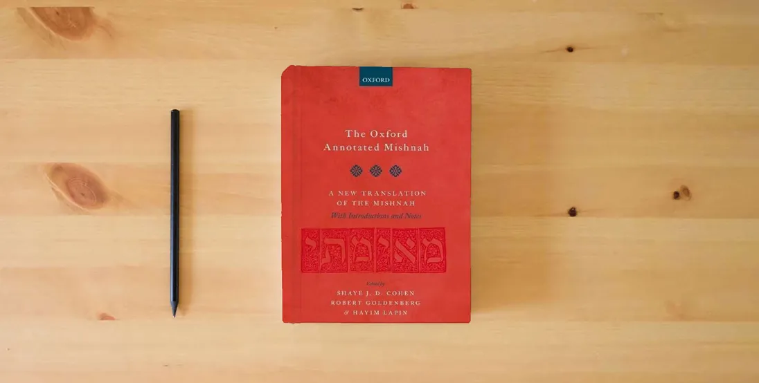 The book The Oxford Annotated Mishnah} is on the table