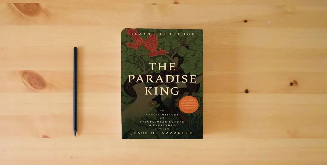 The book The Paradise King: The Tragic History and Spectacular Future of Everything According to Jesus of Nazareth} is on the table