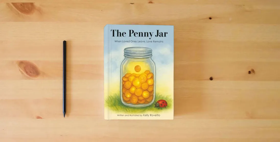 The book The Penny Jar: When Loved Ones Leave, Love Remains} is on the table