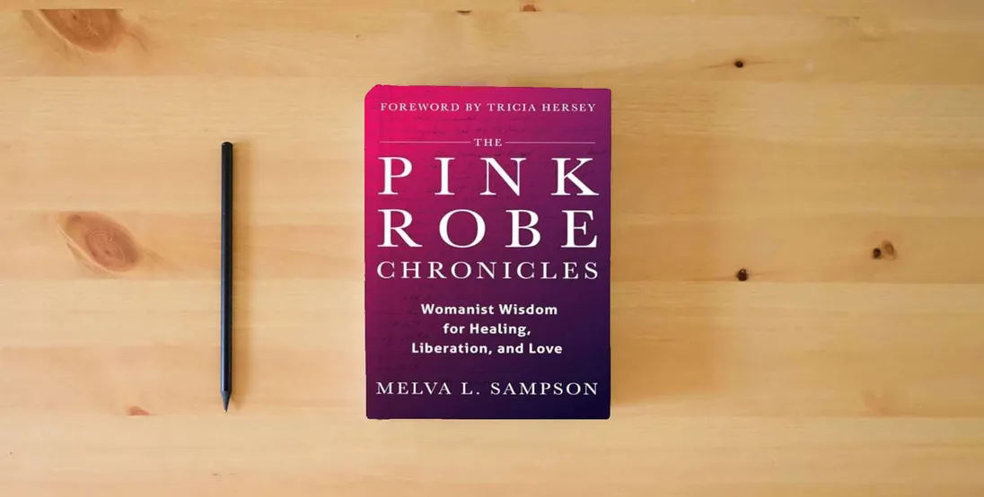 The book The Pink Robe Chronicles: Womanist Wisdom for Healing, Liberation, and Love} is on the table
