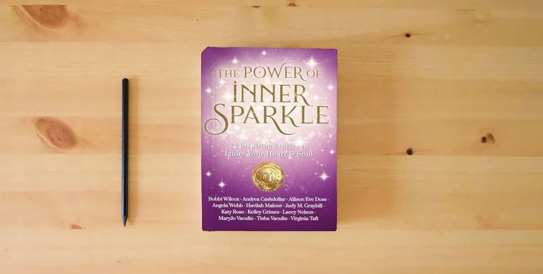The book The Power of Inner Sparkle: 12 Inspiring Stories To Ignite Your Heart & Soul} is on the table