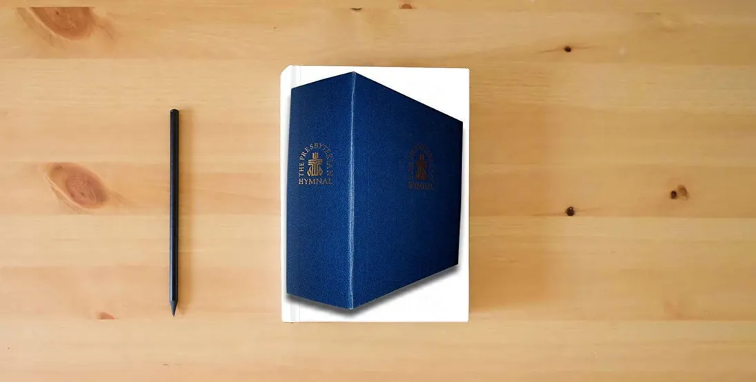 The book The Presbyterian Hymnal, Accompanist's Edition: Hymns, Psalms, and Spiritual Songs (Organist Edition)} is on the table