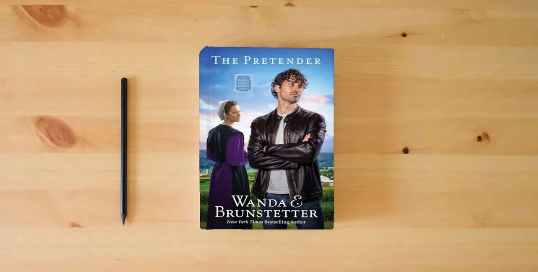 The book The Pretender: The Big Valley Disappearance #3 Volume 3 (A Mifflin County Mystery)} is on the table
