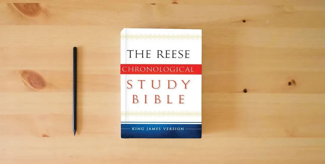 The book The Reese Chronological Study Bible: King James Version} is on the table