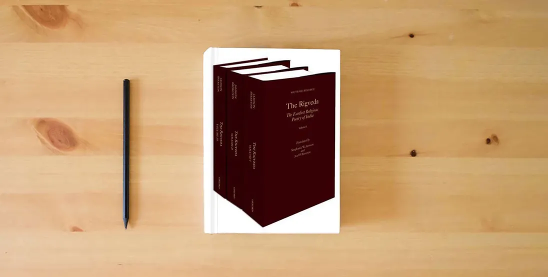 The book The Rigveda: 3-Volume Set (South Asia Research)} is on the table