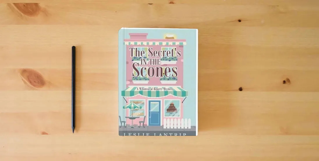 The book The Secret's in the Scones: A Whimsical Bakery Mystery} is on the table