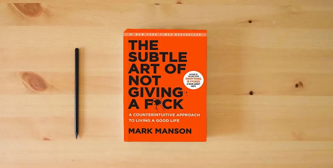 The book The Subtle Art of Not Giving a F*ck: A Counterintuitive Approach to Living a Good Life} is on the table