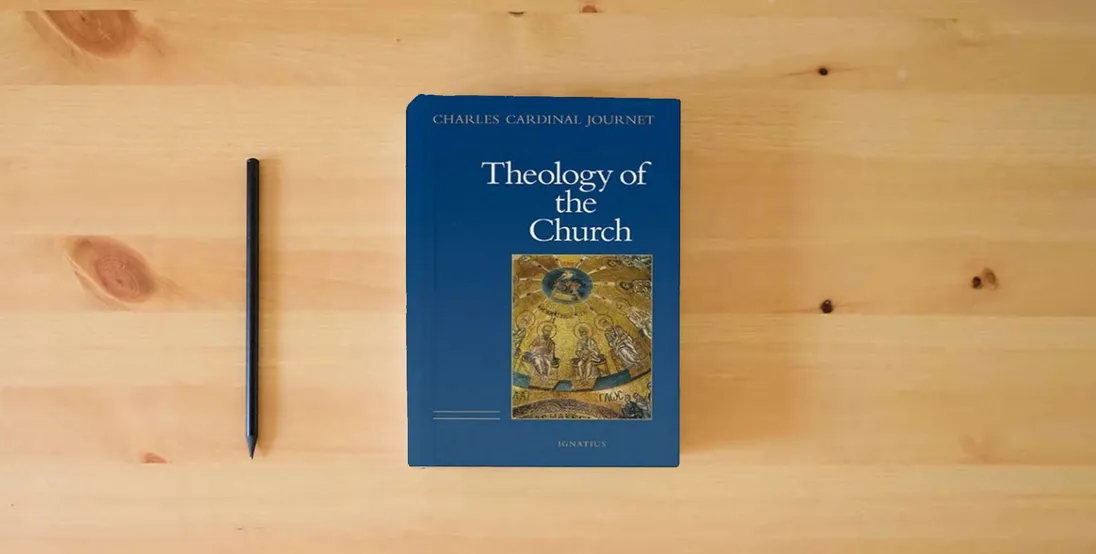 The book The Theology of the Church} is on the table