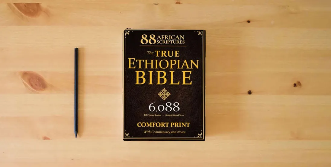 The book THE TRUE ETHIOPIAN BIBLE COMPLETE in English |COMFORT PRINT|: All 88 African Scriptures Including the Book of Enoch, Jubilees, and Missing Apocrypha Once Lost to the Western World (Annotated)} is on the table