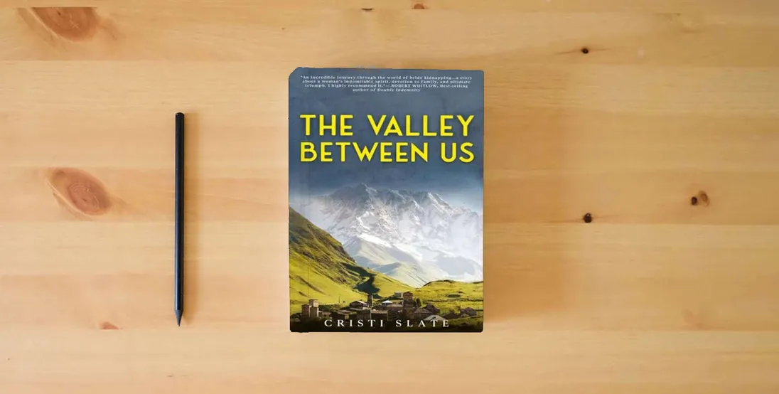 The book The Valley Between Us} is on the table