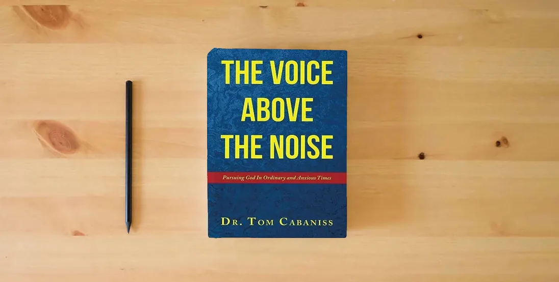 The book The Voice Above The Noise: Pursuing God In Ordinary and Anxious Times} is on the table