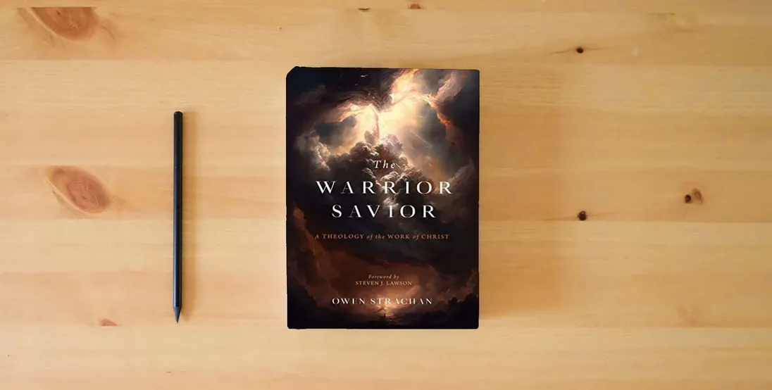 The book The Warrior Savior: A Theology of the Work of Christ} is on the table