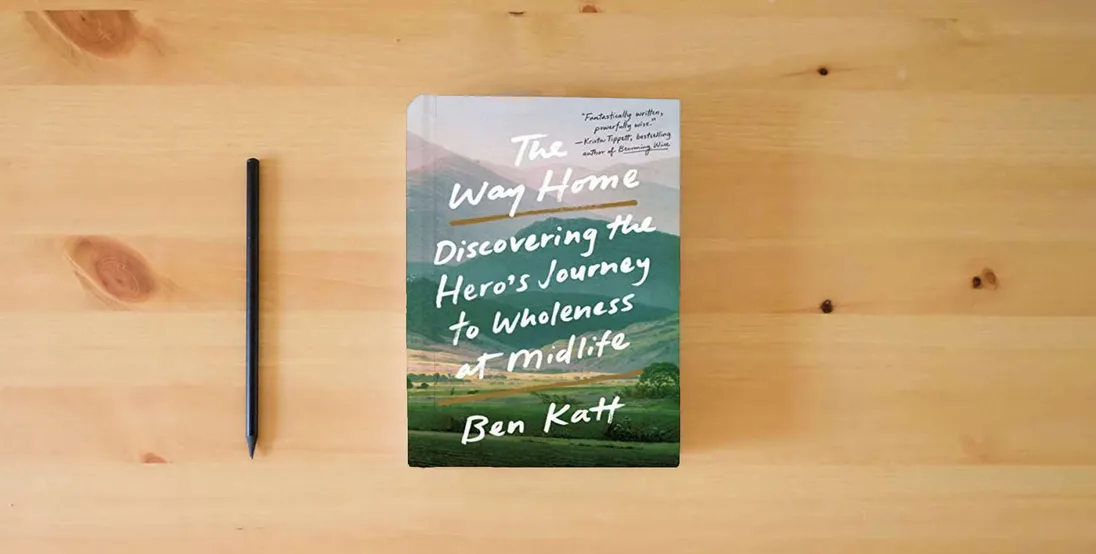 The book The Way Home: Discovering the Hero's Journey to Wholeness at Midlife} is on the table
