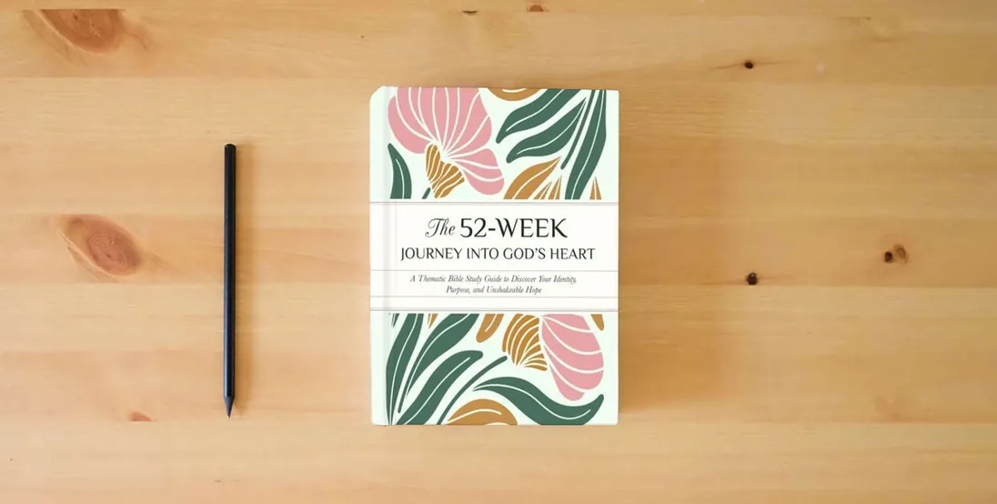 The book The 52-Week Journey into God’s Heart: A Thematic Bible Study Guide to Discover Your Identity, Purpose, and Unshakeable Hope author} is on the table