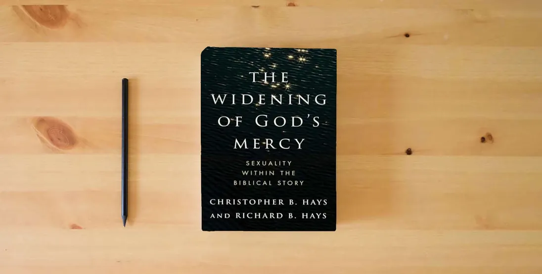 The book The Widening of God's Mercy: Sexuality Within the Biblical Story} is on the table