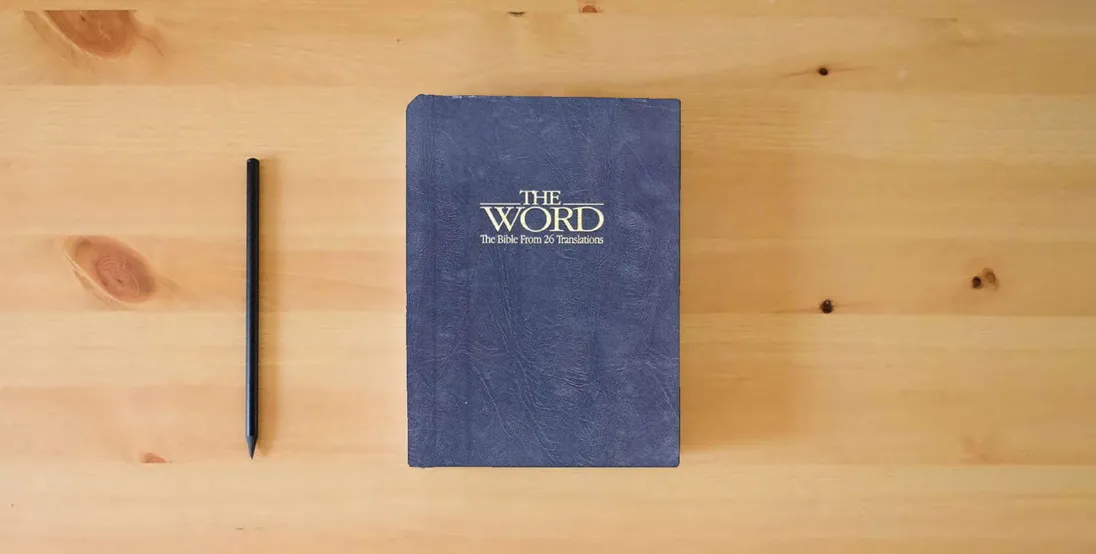 The book The Word: The Bible from 26 Translations} is on the table