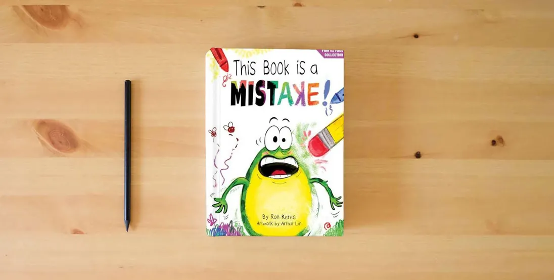 The book This Book Is A Mistake!: A Funny And Interactive Story For Kids (Finn the Frog Collection)} is on the table