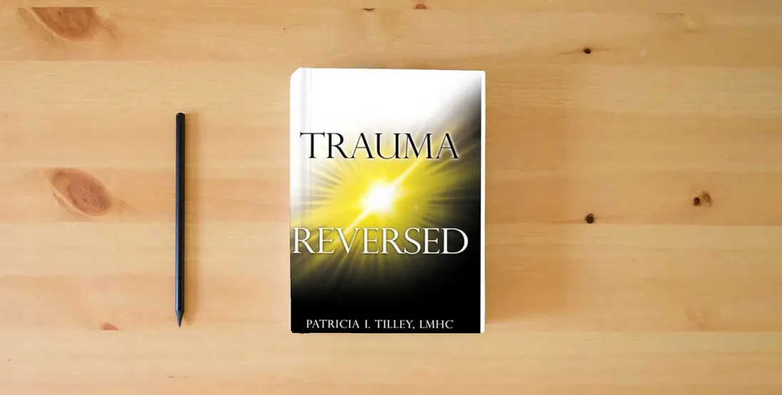 The book Trauma Reversed} is on the table