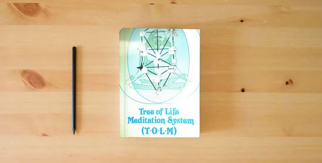 The book Tree of Life Meditation System (T.O.L.M.)} is on the table