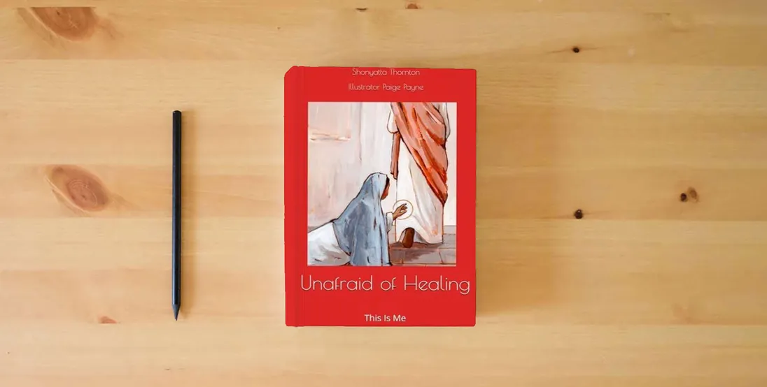 The book Unafraid of Healing: This Is Me} is on the table