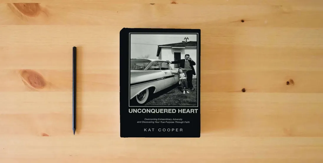 The book Unconquered Heart: Overcoming Extraordinary Adversity and Discovering Your True Purpose Through Faith} is on the table