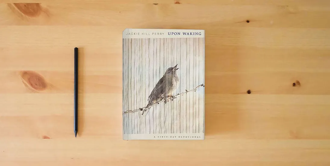 The book Upon Waking: 60 Daily Reflections to Discover Ourselves and the God We Were Made For} is on the table