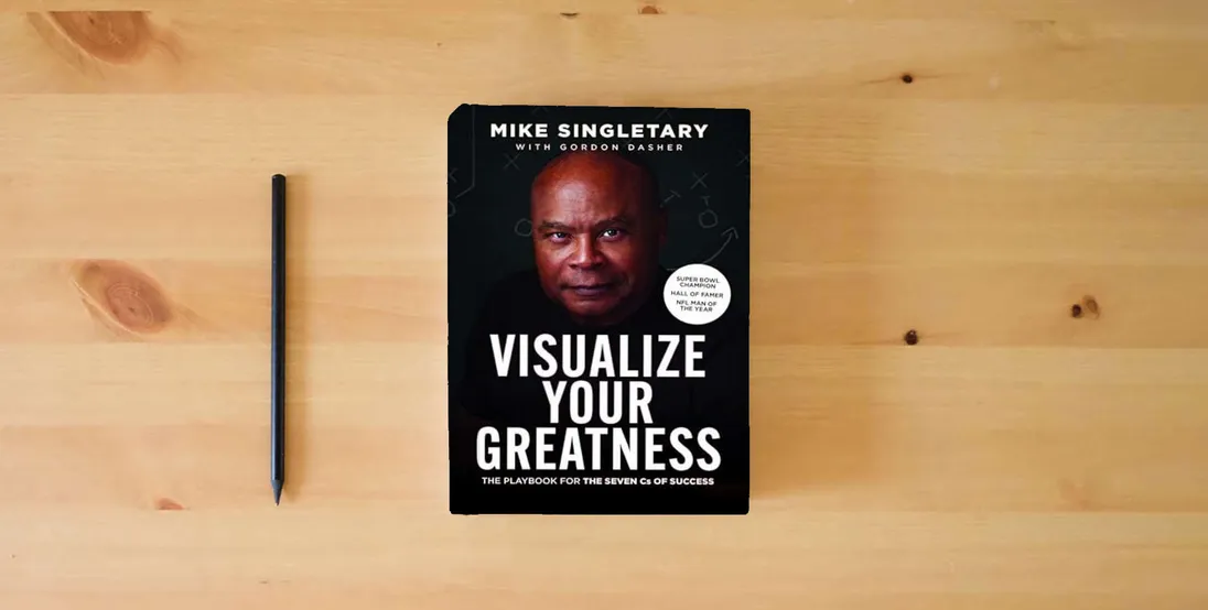 The book Visualize Your Greatness: The Playbook for the Seven Cs of Success} is on the table