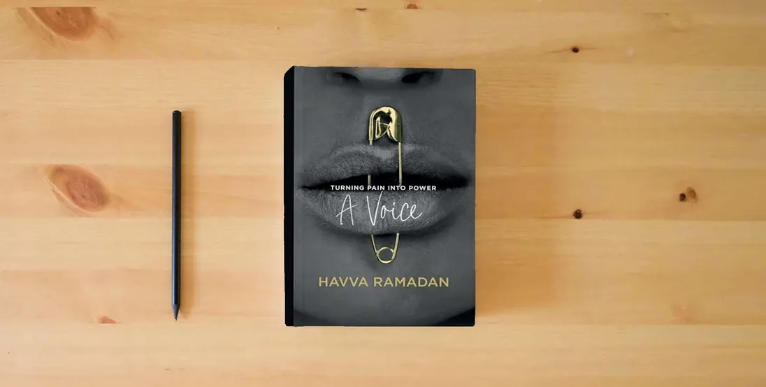 The book A Voice: Turning Pain into Power} is on the table