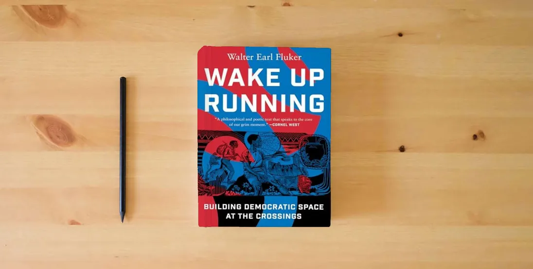 The book Wake Up Running: Building Democratic Space at the Crossings} is on the table
