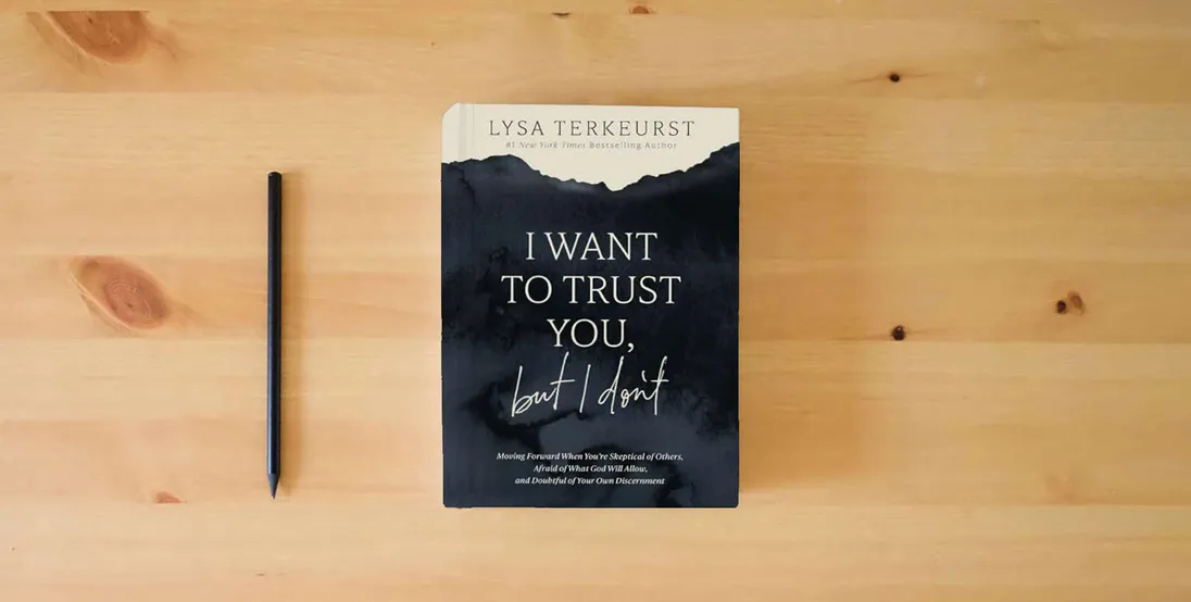 The book I Want to Trust You, but I Don't: Moving Forward When You’re Skeptical of Others, Afraid of What God Will Allow, and Doubtful of Your Own Discernment} is on the table