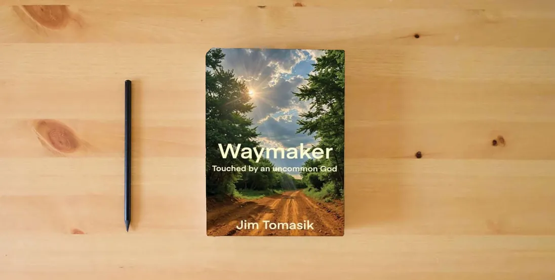 The book Waymaker: Touched by an uncommon God} is on the table
