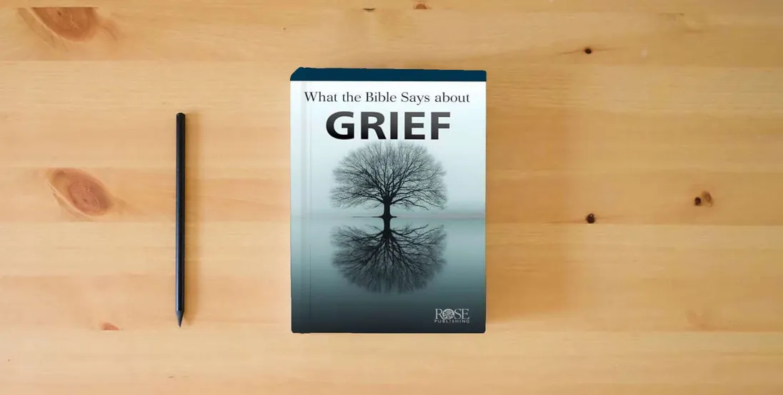 The book What the Bible Says About Grief} is on the table