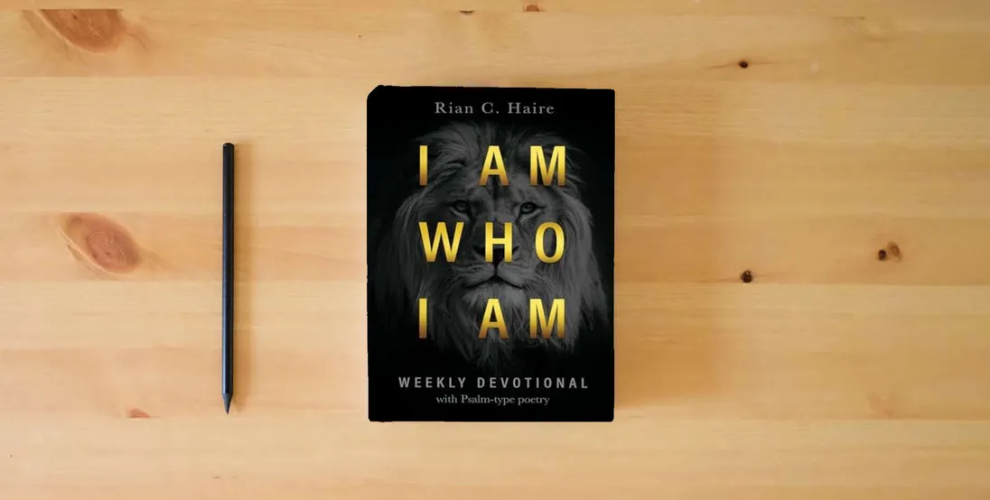 The book I Am Who I Am: Weekly Devotional With Psalm-type Poetry} is on the table