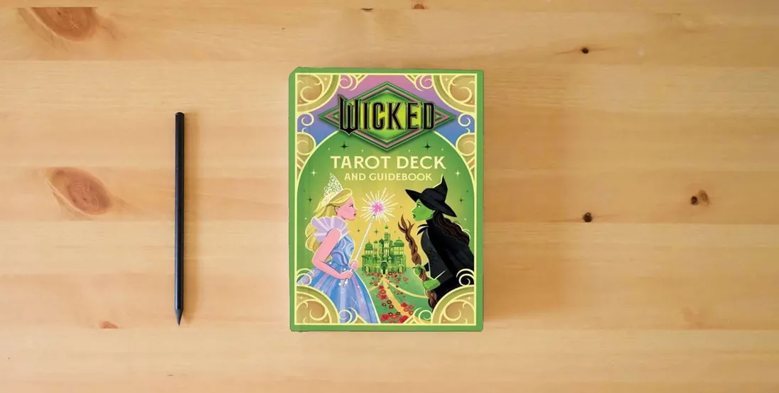 The book Wicked Tarot Deck and Guidebook (Tarot/Oracle Decks)} is on the table