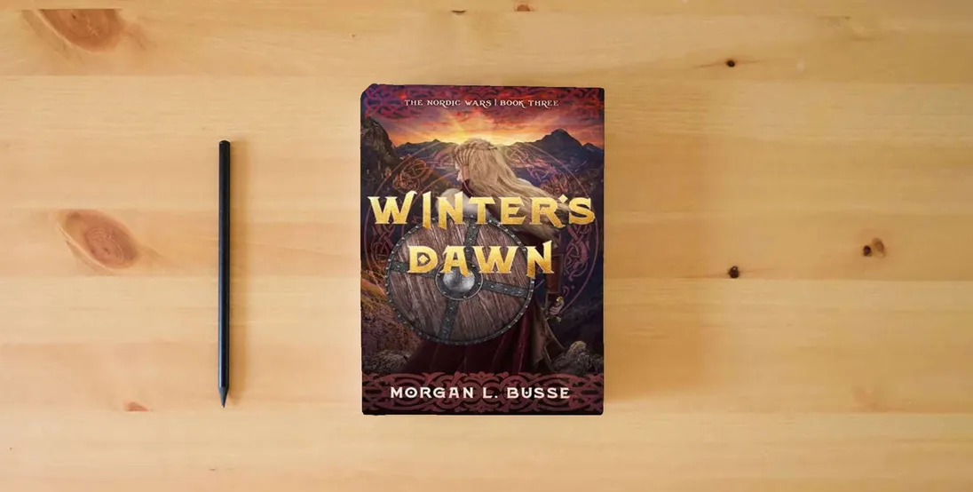 The book Winter's Dawn (Volume 3) (The Nordic Wars)} is on the table
