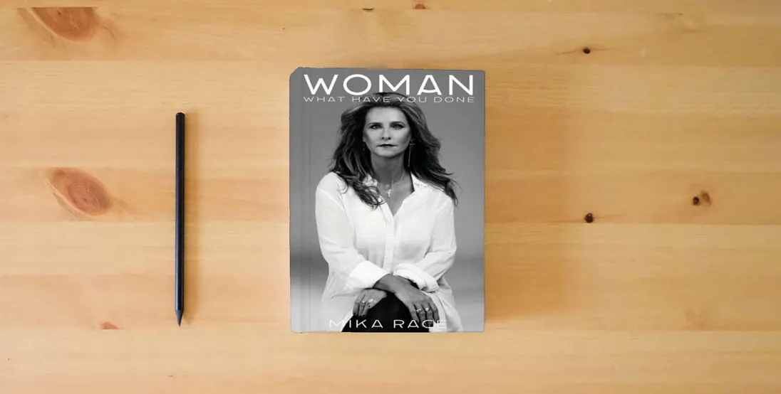 The book Woman} is on the table