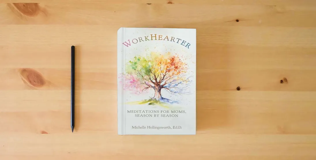 The book WorkHearter: Meditations for Moms, Season by Season} is on the table
