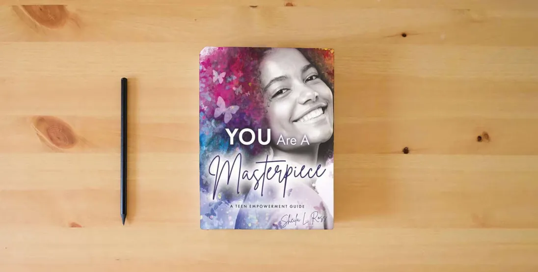 The book You Are A Masterpiece: A Teen Empowerment Guide} is on the table