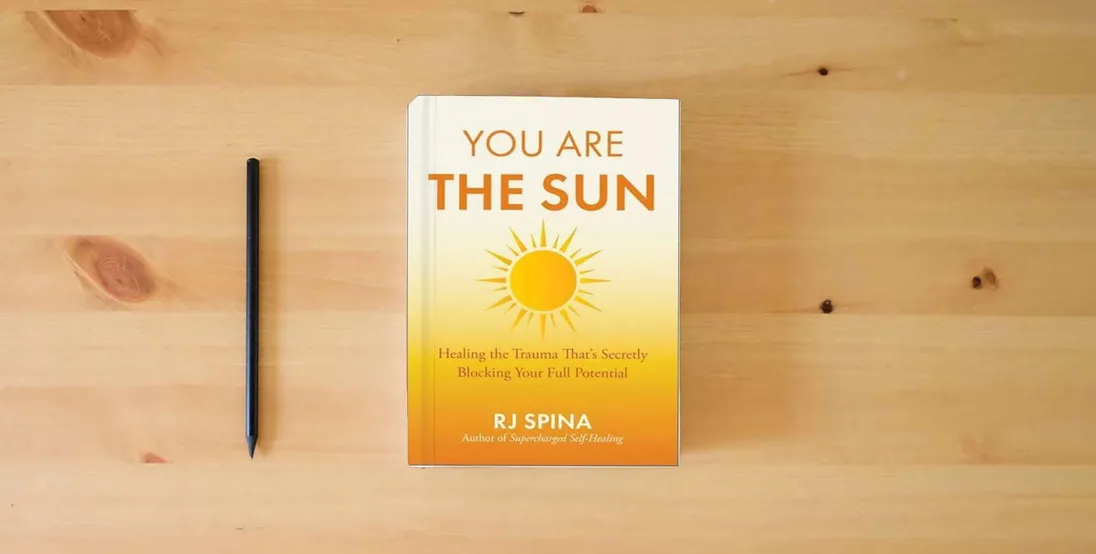 The book You Are the Sun: Healing the Trauma That's Secretly Blocking Your Full Potential} is on the table