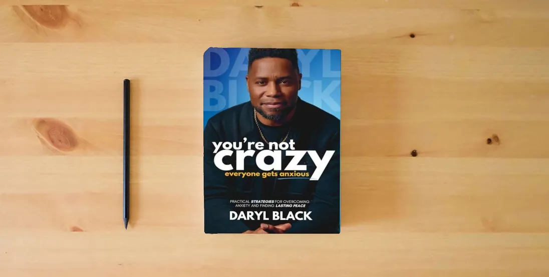 The book You're Not Crazy: Everyone Gets Anxious: Practical strategies for overcoming anxiety and finding lasting peace} is on the table