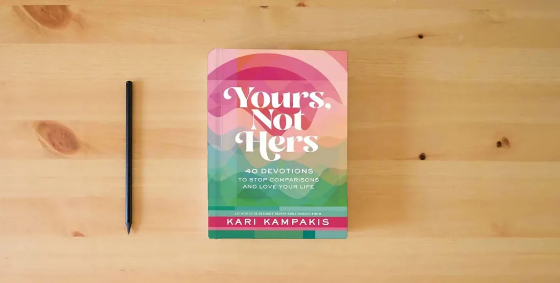 The book Yours, Not Hers: 40 Devotions to Stop Comparisons and Love Your Life} is on the table