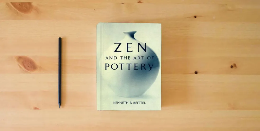 The book Zen And The Art Of Pottery} is on the table